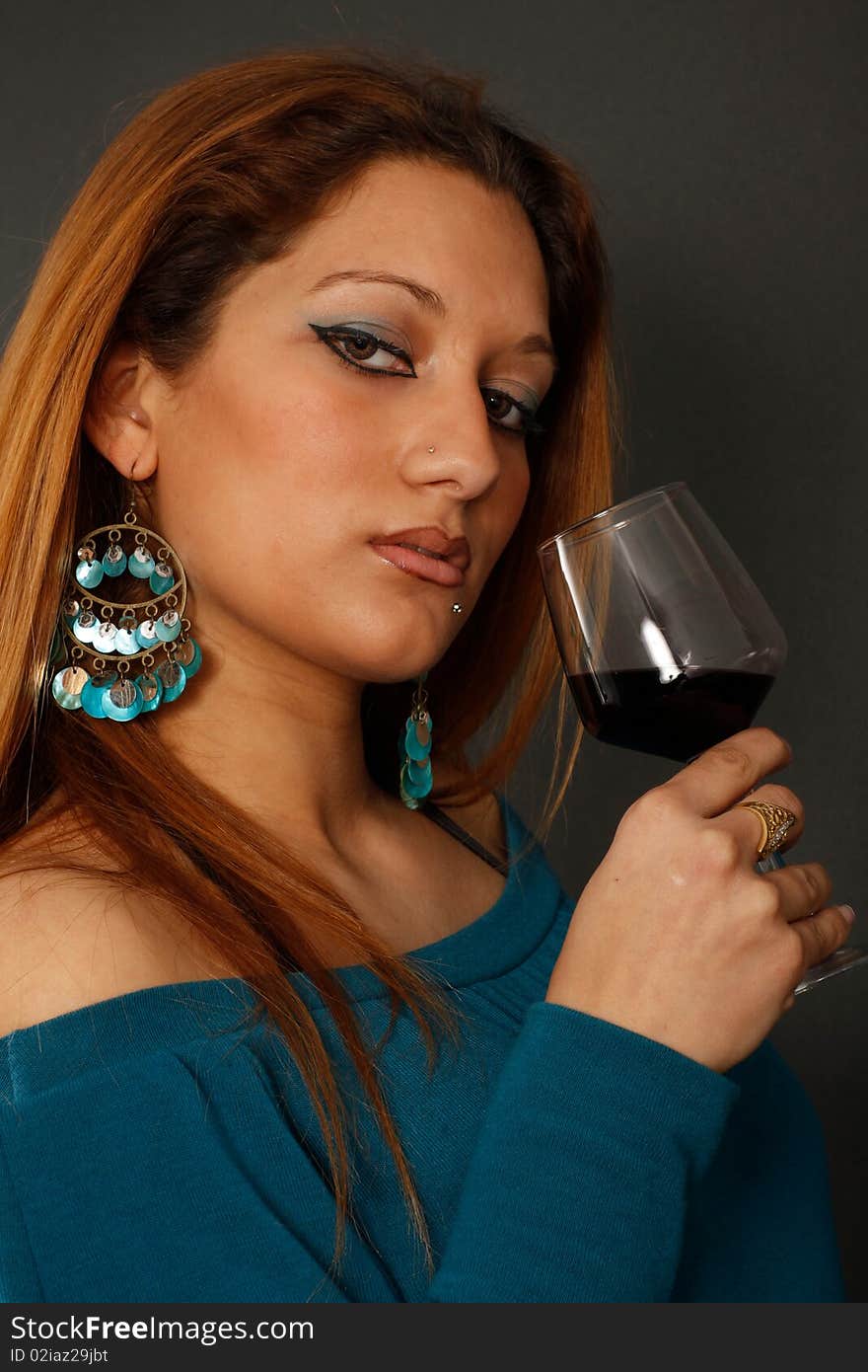 Spanish girl drinking wine