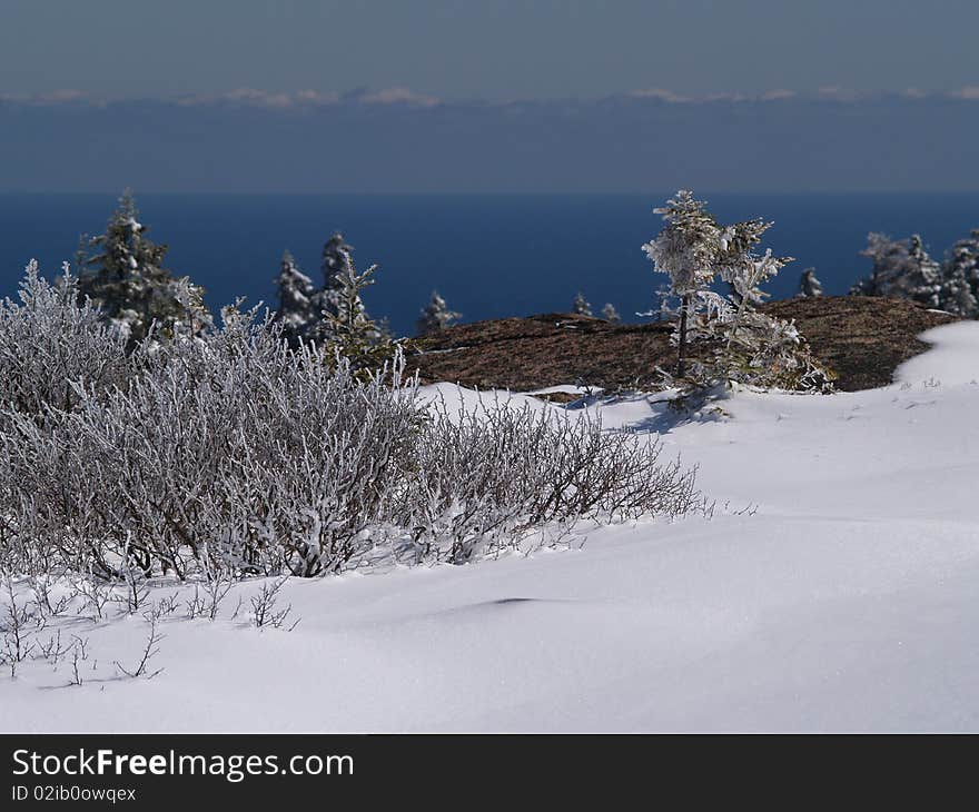 Snow and Ice covered summit of a coastal mountain. Snow and Ice covered summit of a coastal mountain