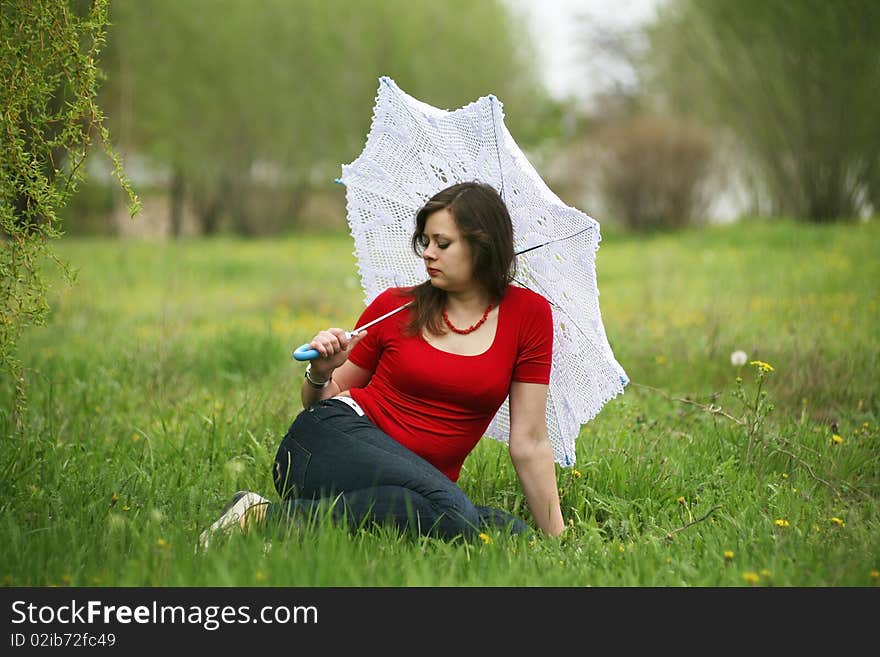 Girl with white umbrella in the meadow. Girl with white umbrella in the meadow