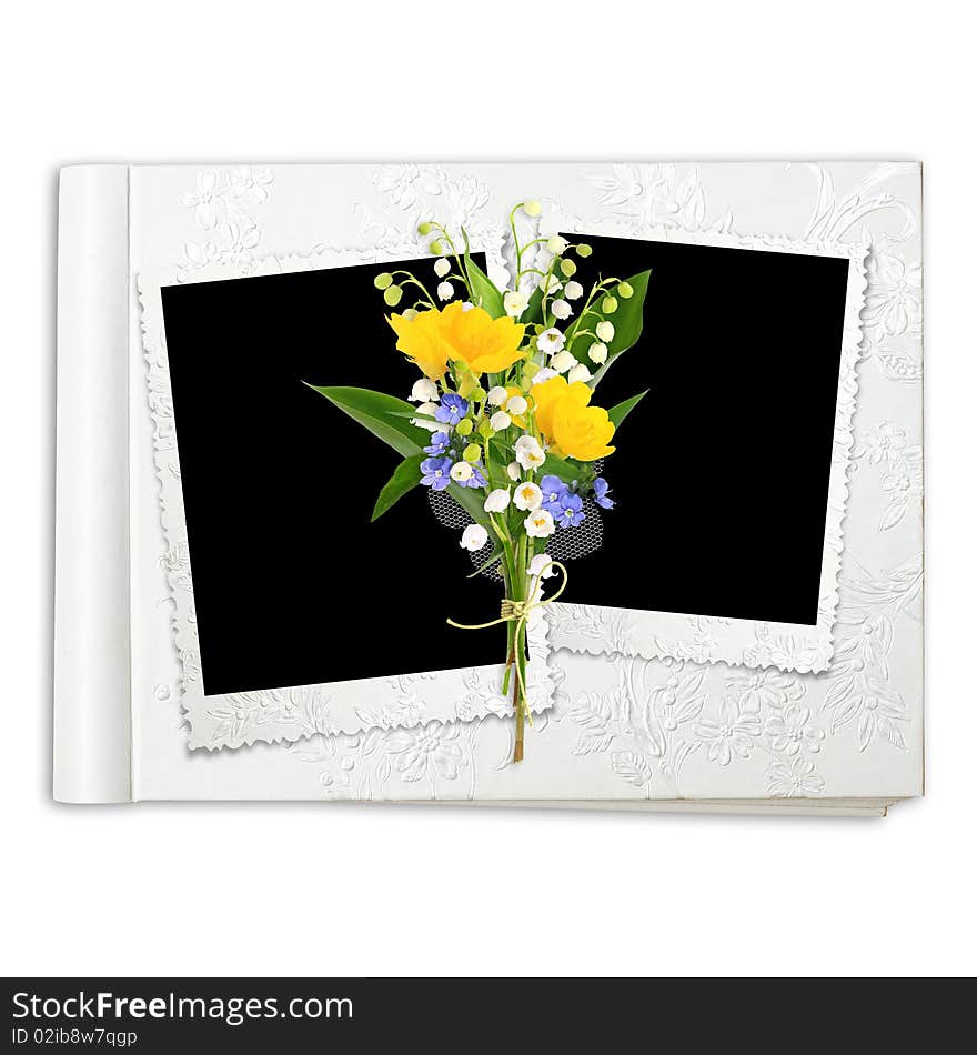 Album with frame and spring flowers on the white