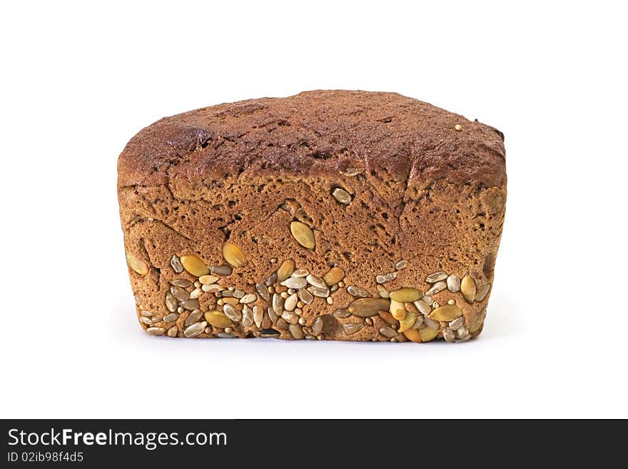 Whole brown bread with grain isolated on a white background. Whole brown bread with grain isolated on a white background.