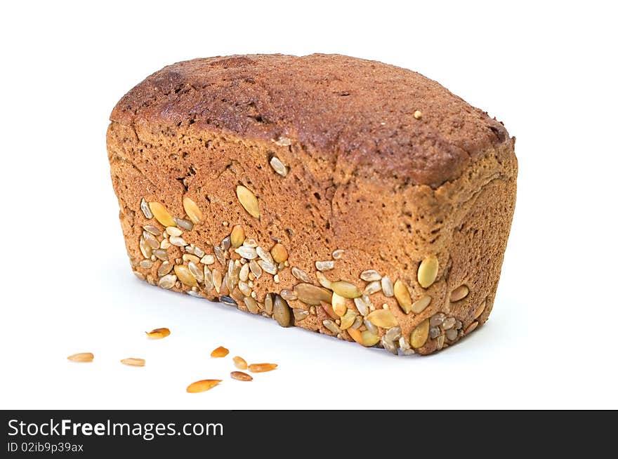 Whole brown bread with grain isolated on a white background. Whole brown bread with grain isolated on a white background.