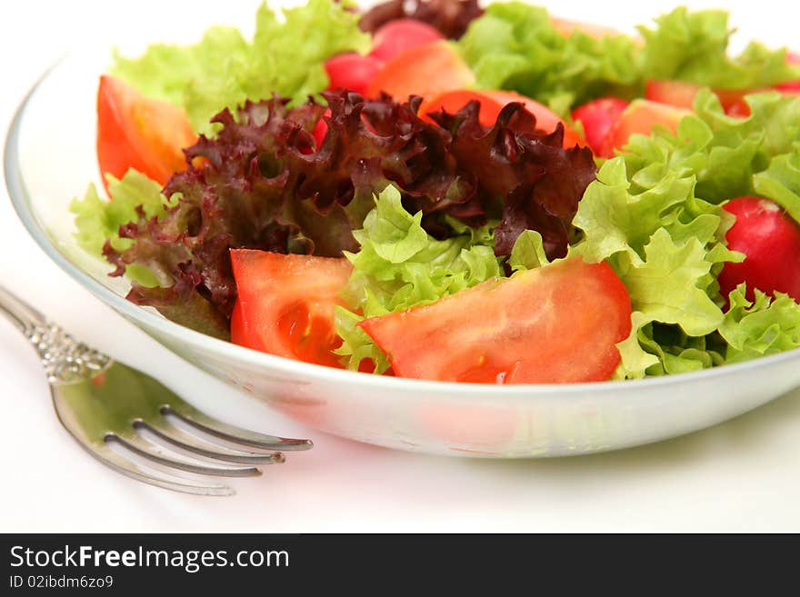 Salad from vegetables on a white background