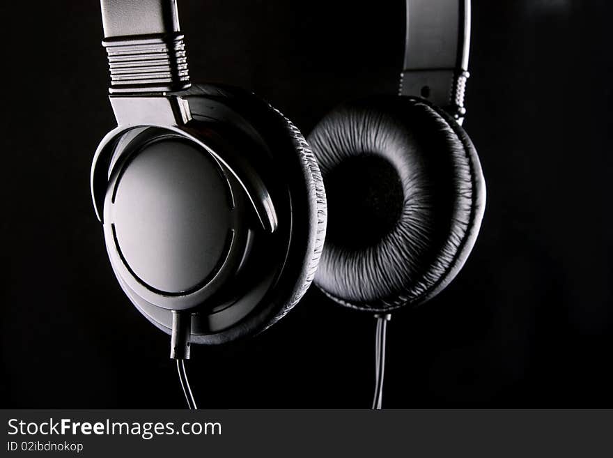 The low-key photo of a stereo headphones. The low-key photo of a stereo headphones