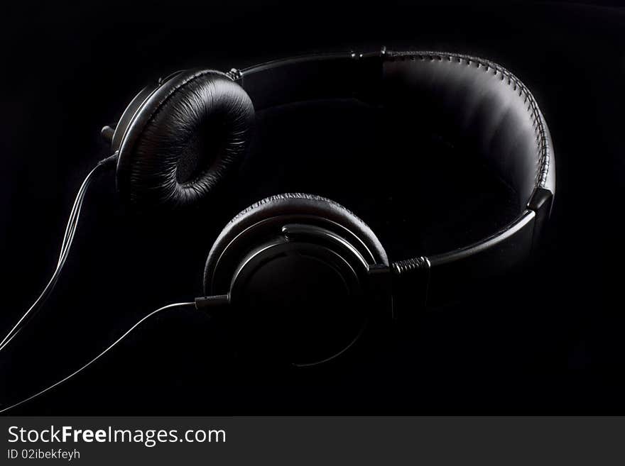 The low-key photo of a stereo headphones. The low-key photo of a stereo headphones