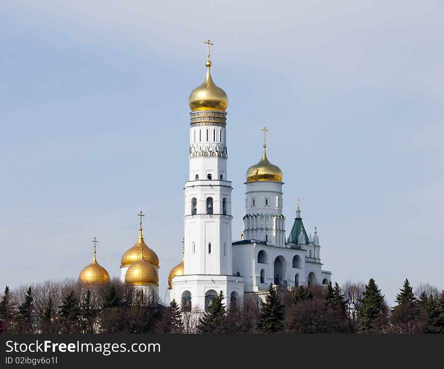 Photo of the Belltower of Ivan Great in Moscow because of the Kremlin wall. Photo of the Belltower of Ivan Great in Moscow because of the Kremlin wall.