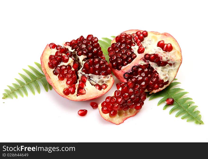 Ripe pomegranate on a white background