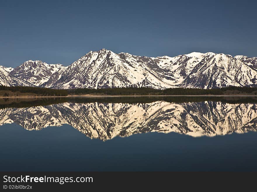 Reflection in the lac of the Grand Tetons in Wyoming