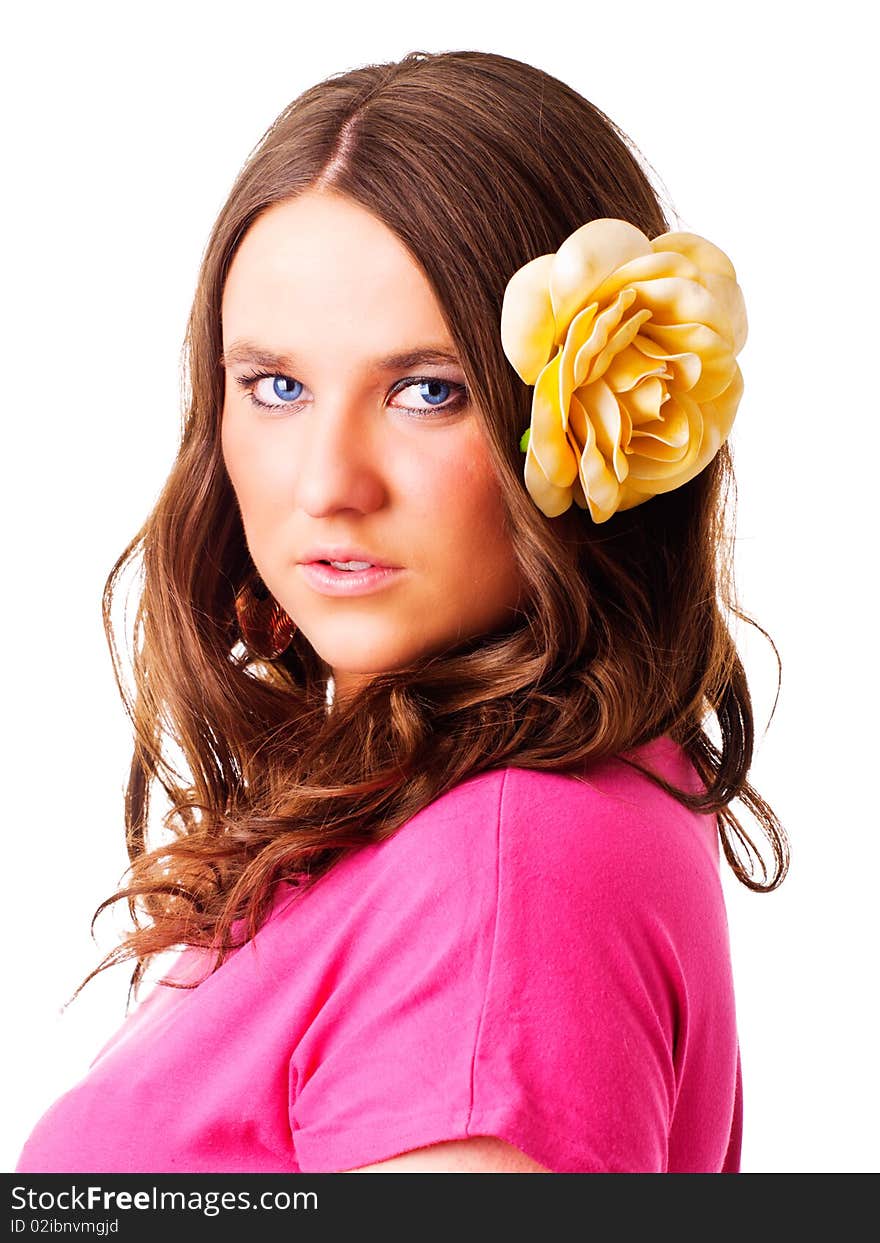 Girl with flower in hair over white