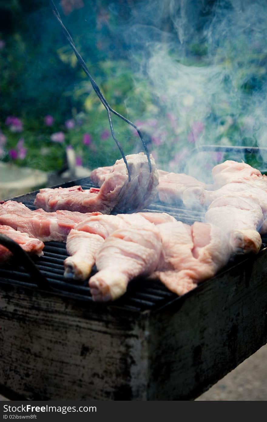 Image of chicken legs being grilled. Image of chicken legs being grilled.