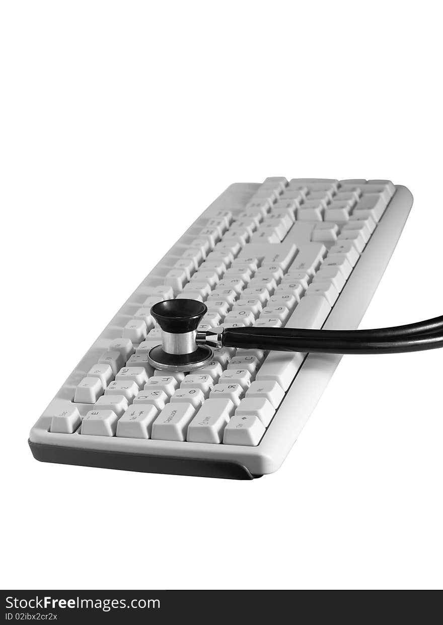 The keyboard is listened by means of a phonendoscope on a white background close up isolated. The keyboard is listened by means of a phonendoscope on a white background close up isolated