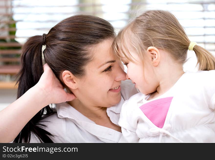 Mother and daughter having fun at home. Mother and daughter having fun at home