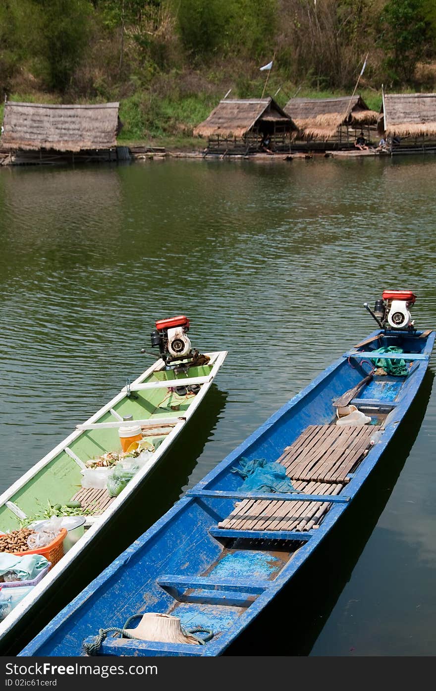 Row boats for bring a traveling raft into the lake, Loei Province, Thailand. Row boats for bring a traveling raft into the lake, Loei Province, Thailand.