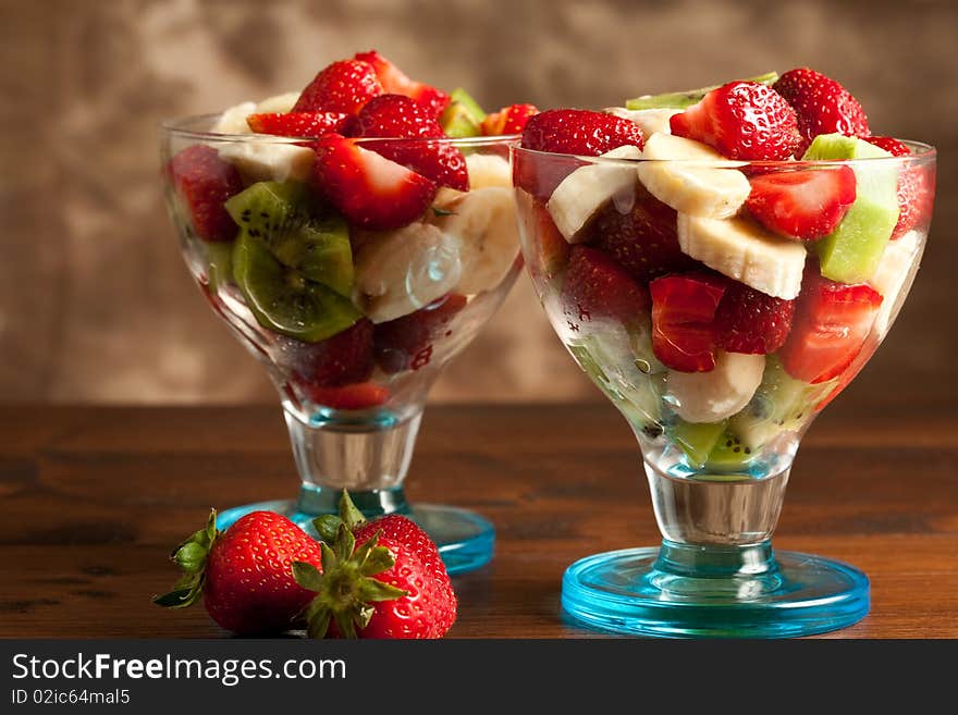 Photo of tasty fruitsalad in calix with strawberries. Photo of tasty fruitsalad in calix with strawberries