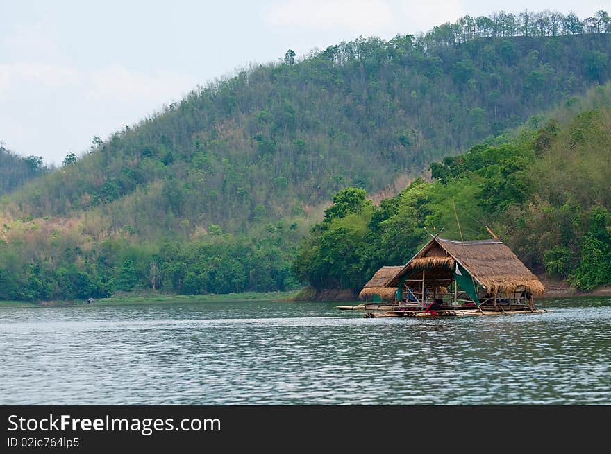 Traveling raft floating in the lake in the afternoon. The boat bring it into the lake. Travelers can stay everytime. Loei province, Thailand. Traveling raft floating in the lake in the afternoon. The boat bring it into the lake. Travelers can stay everytime. Loei province, Thailand.