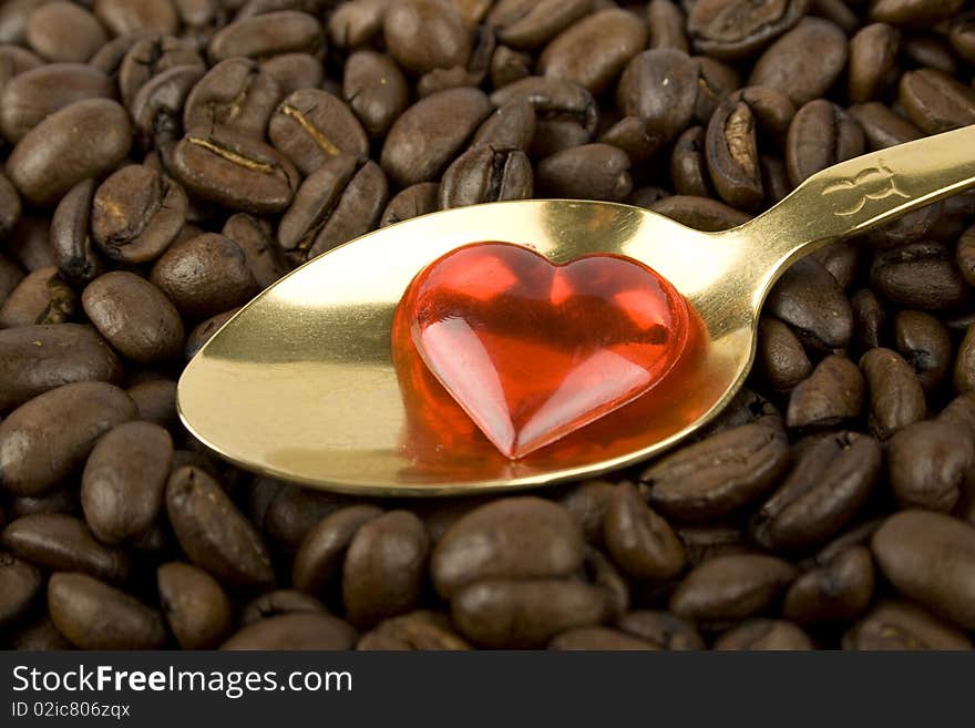 Many coffee beans with red heart