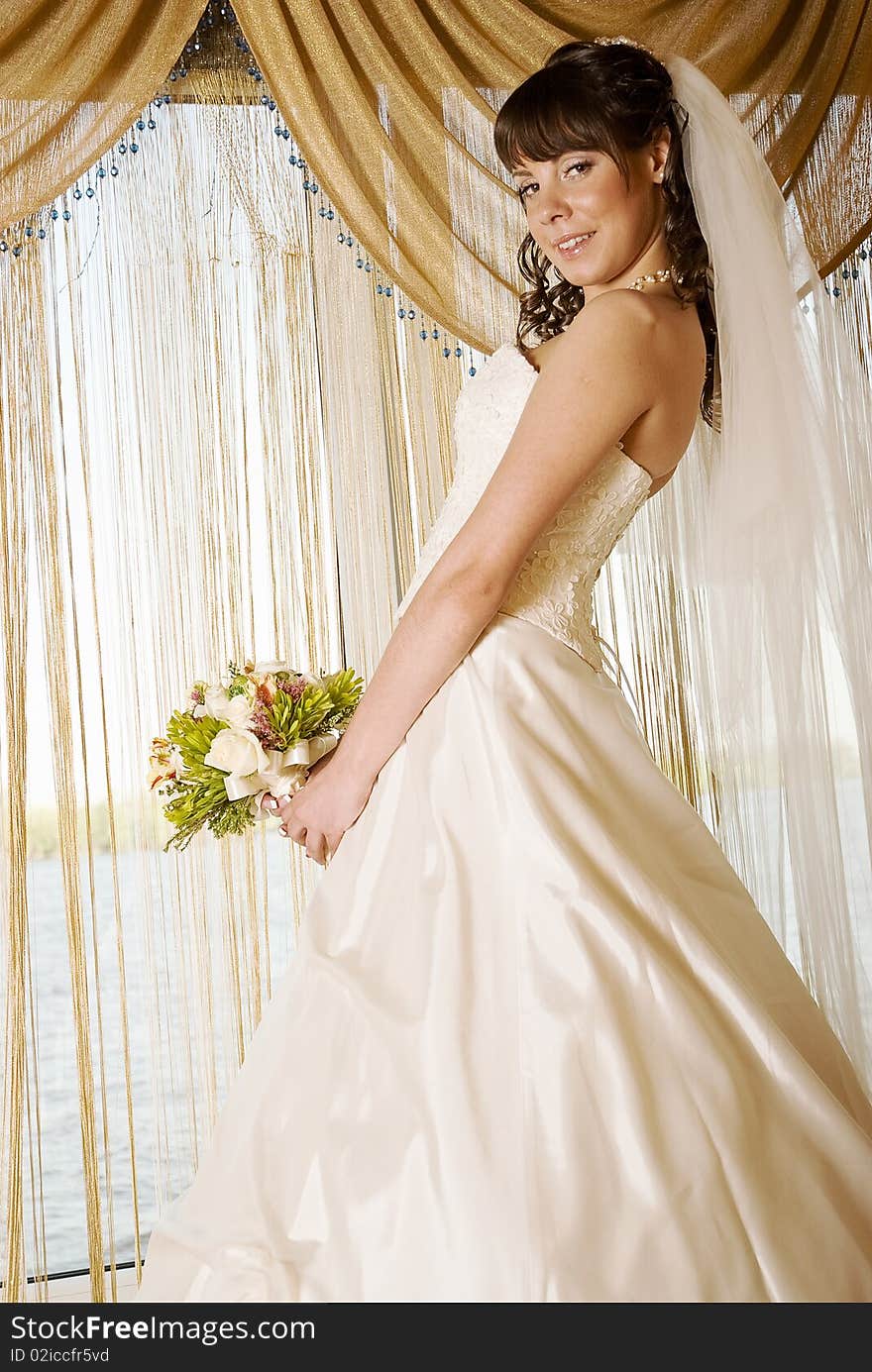 Bride in front of a window