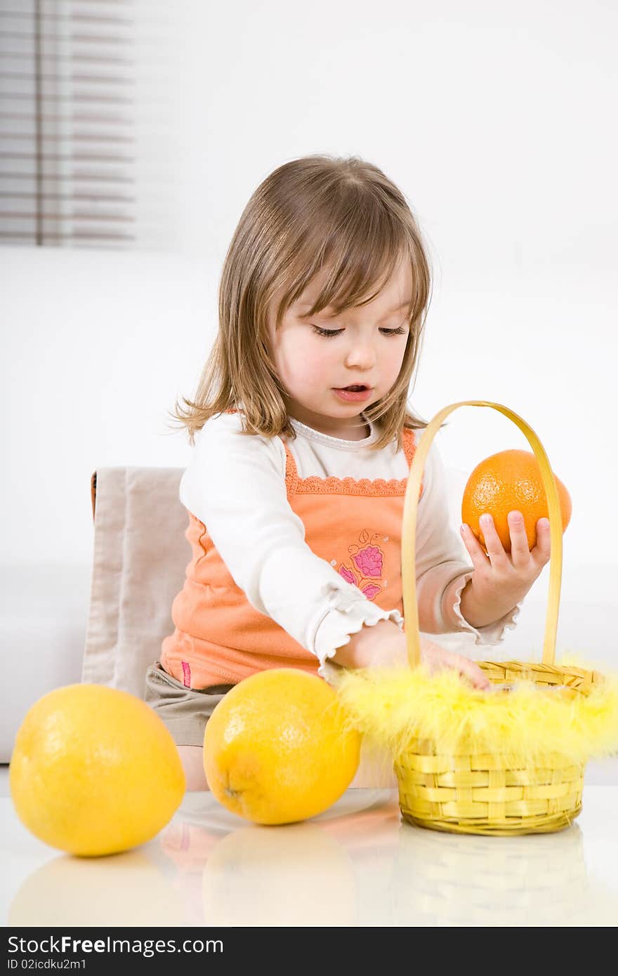 Little girl with fruits