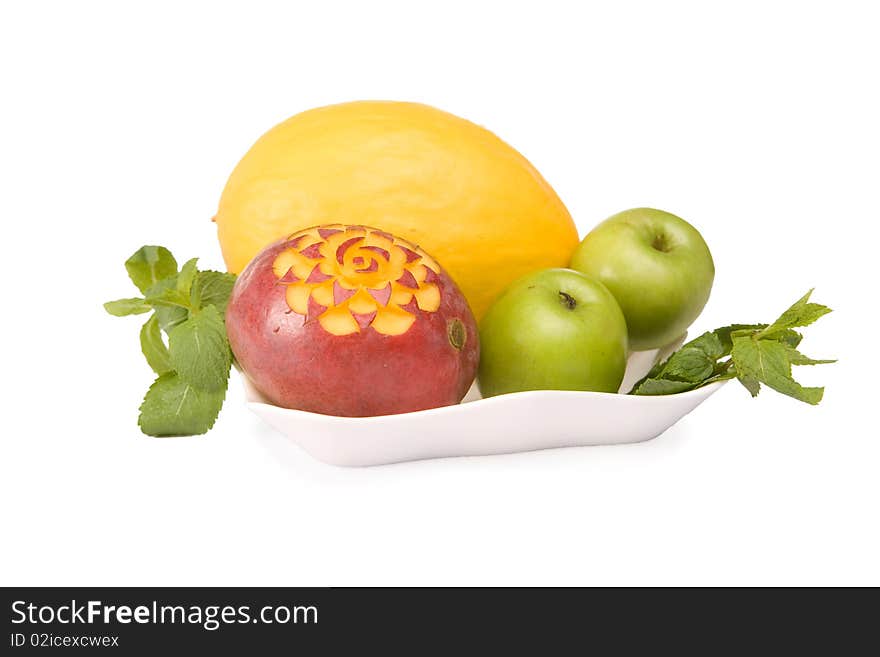 Fruits on a plate isolated on white background