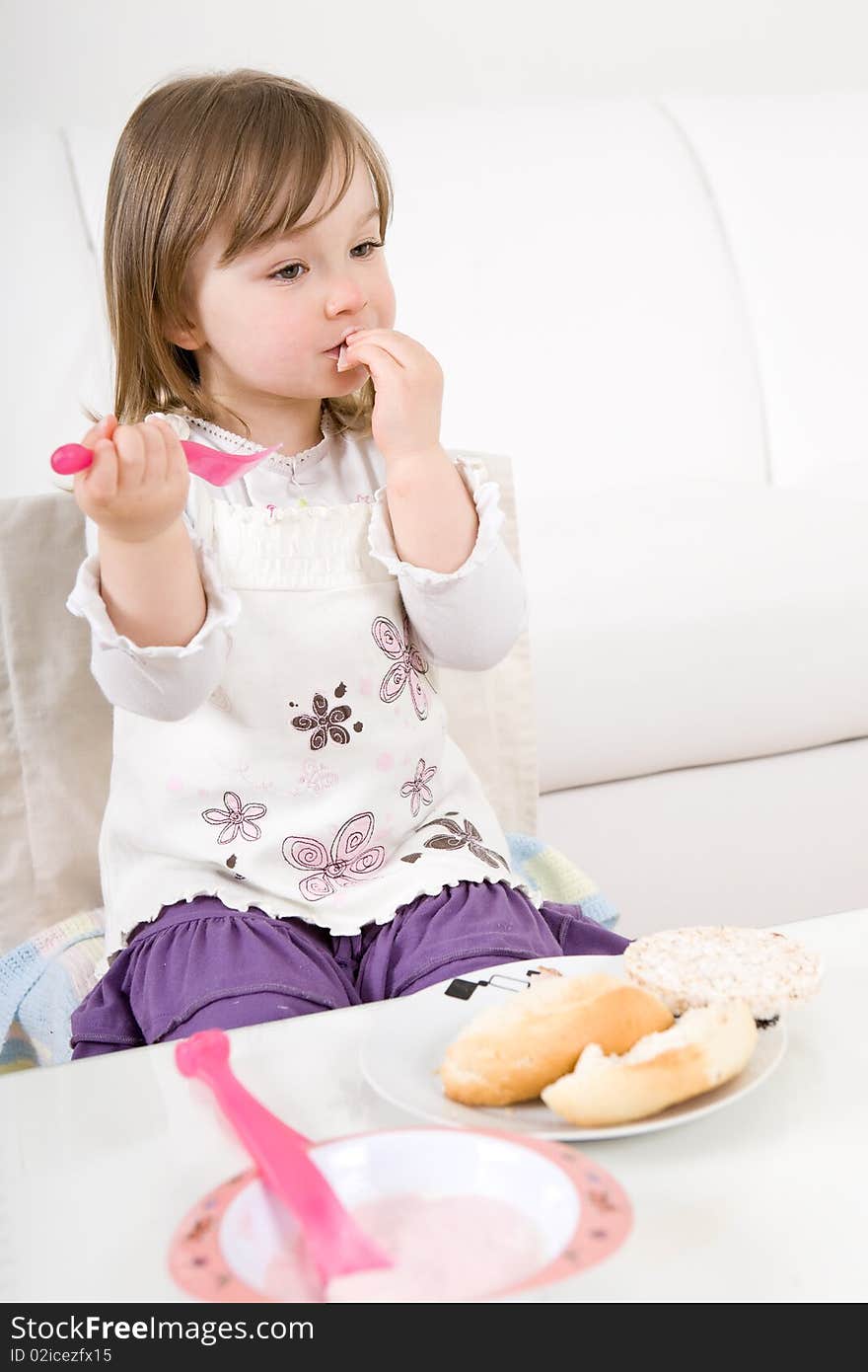 Sweet toddler little girl eating