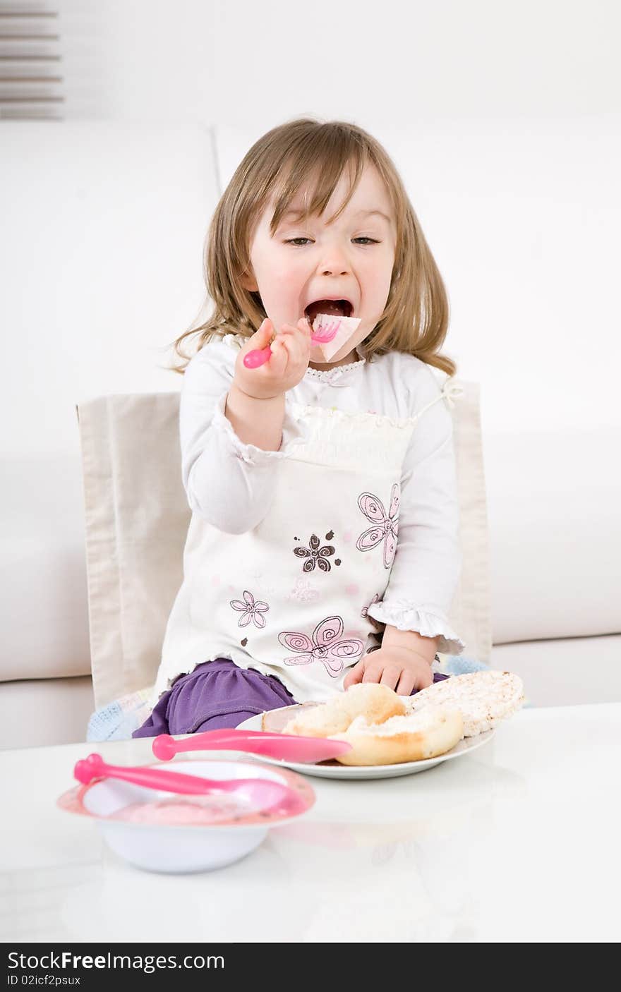 Sweet toddler little girl eating