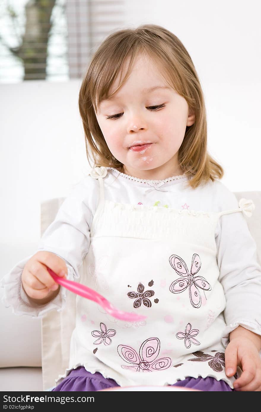 Sweet toddler little girl eating