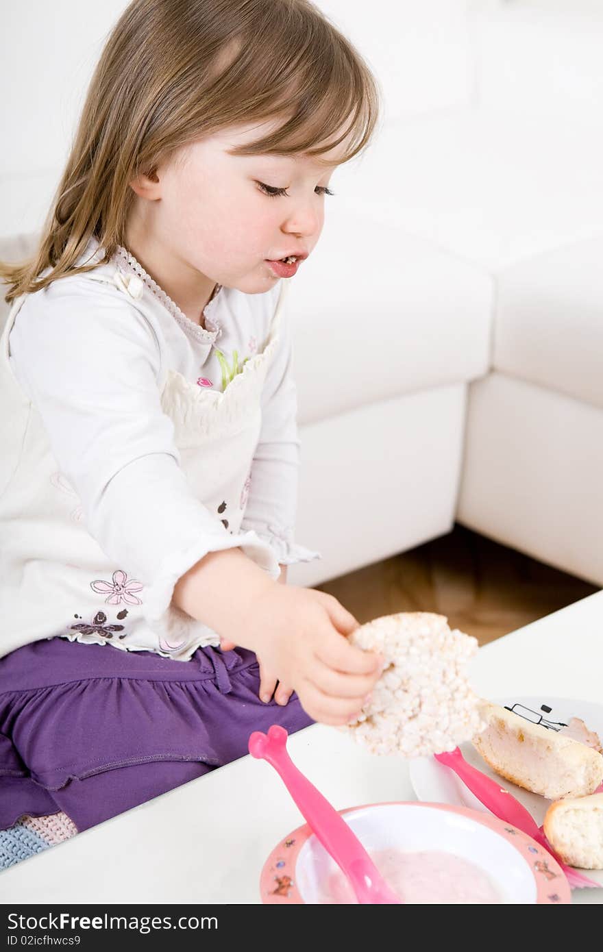 Sweet toddler little girl eating