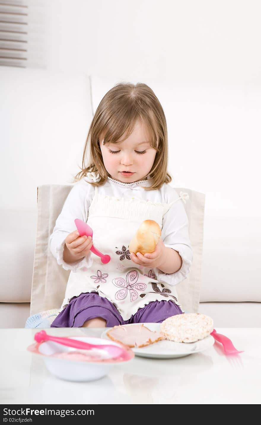 Sweet toddler little girl eating