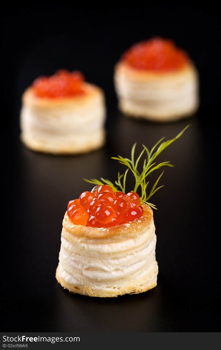 Tartlets with red caviar