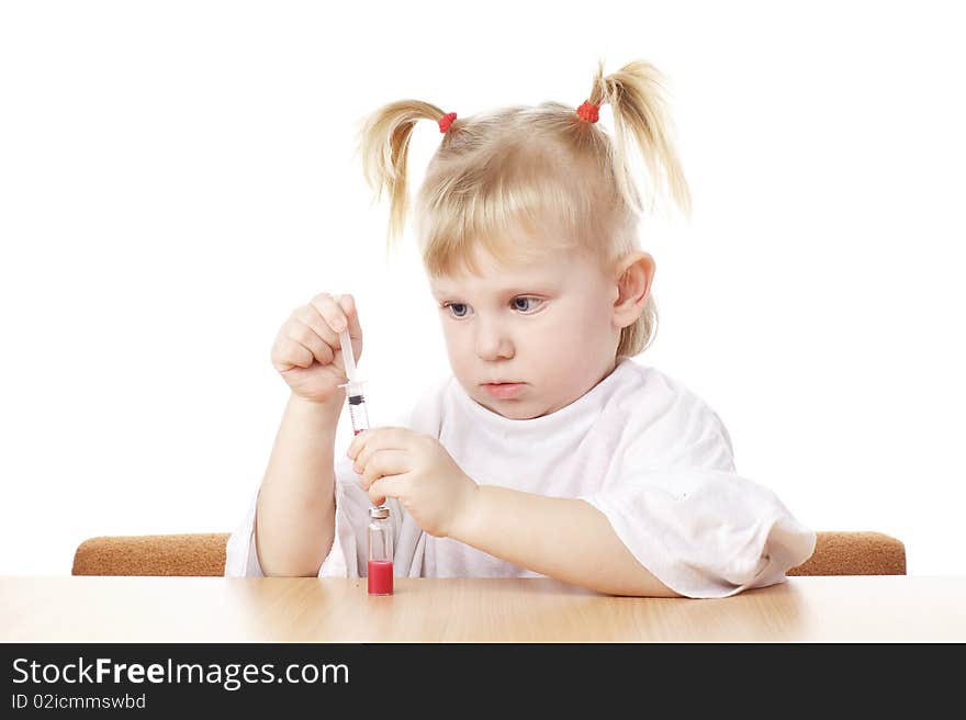 Child playing with a syringe