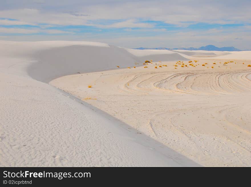 Curved dunes with blue sky