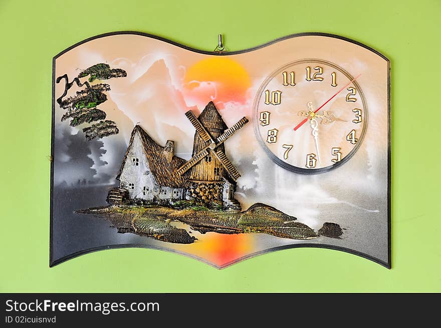 This is a picture hanging on the wall, hand-carved clock with beautiful colors. This is a picture hanging on the wall, hand-carved clock with beautiful colors.