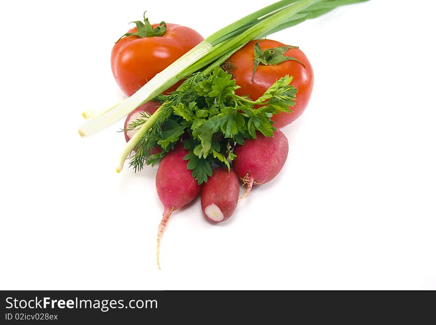 Green onions, tomatoes, radishes and green isolated on white background. Green onions, tomatoes, radishes and green isolated on white background