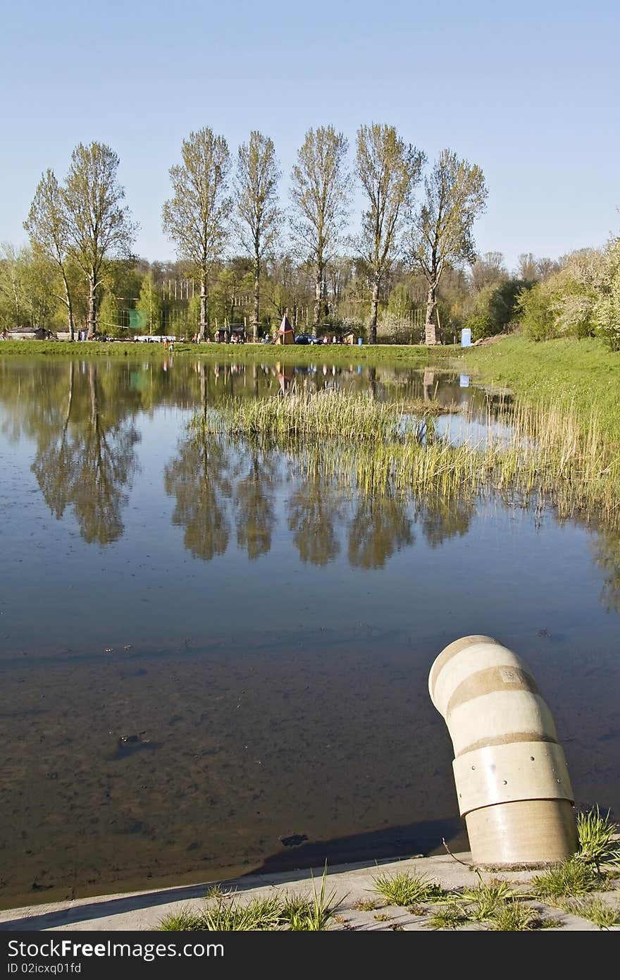 Spring park near industrial terrain. Pollution threat. Spring park near industrial terrain. Pollution threat.