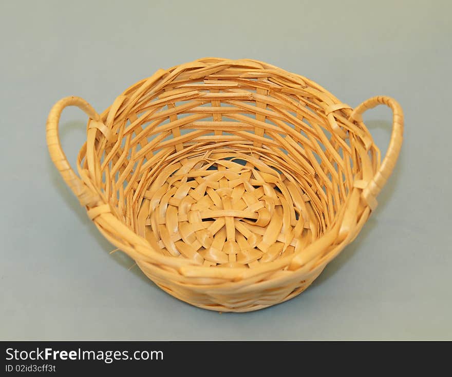 Wicker basket, isolated on grey