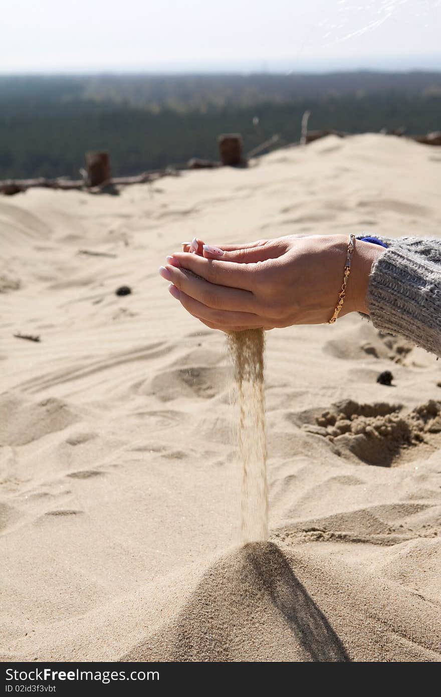 Hands playing with sand.Sand in hands