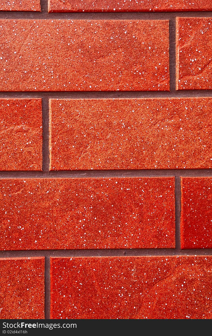 Dark red brick tile wall closeup view. Dark red brick tile wall closeup view.