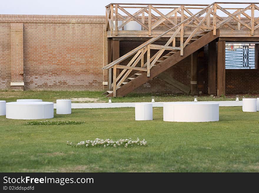 Tables and stools cylinder in a garden. Tables and stools cylinder in a garden