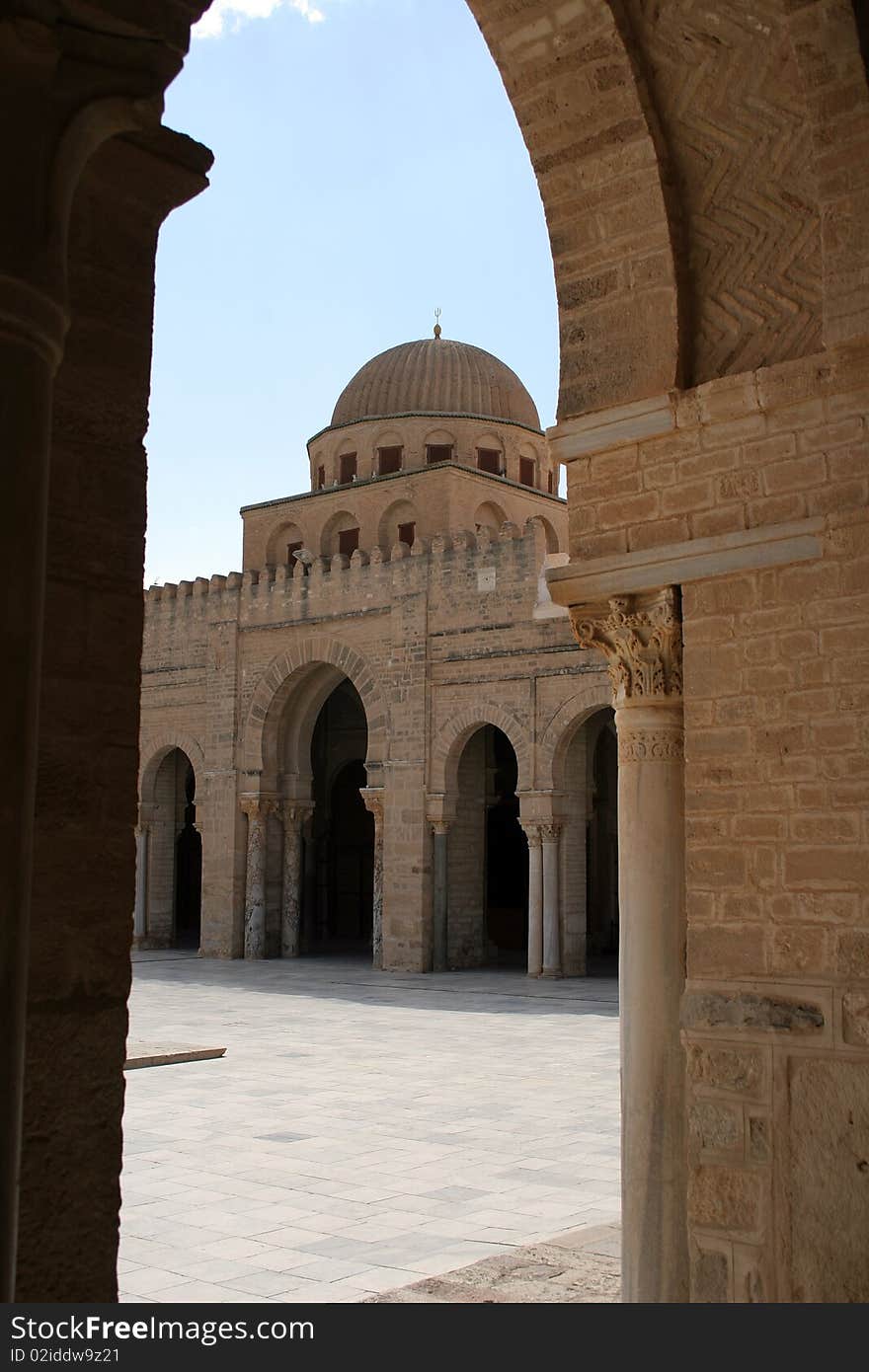 View to the tower of Great mosque from a court yard in Kairuan in Tunisia in Africa