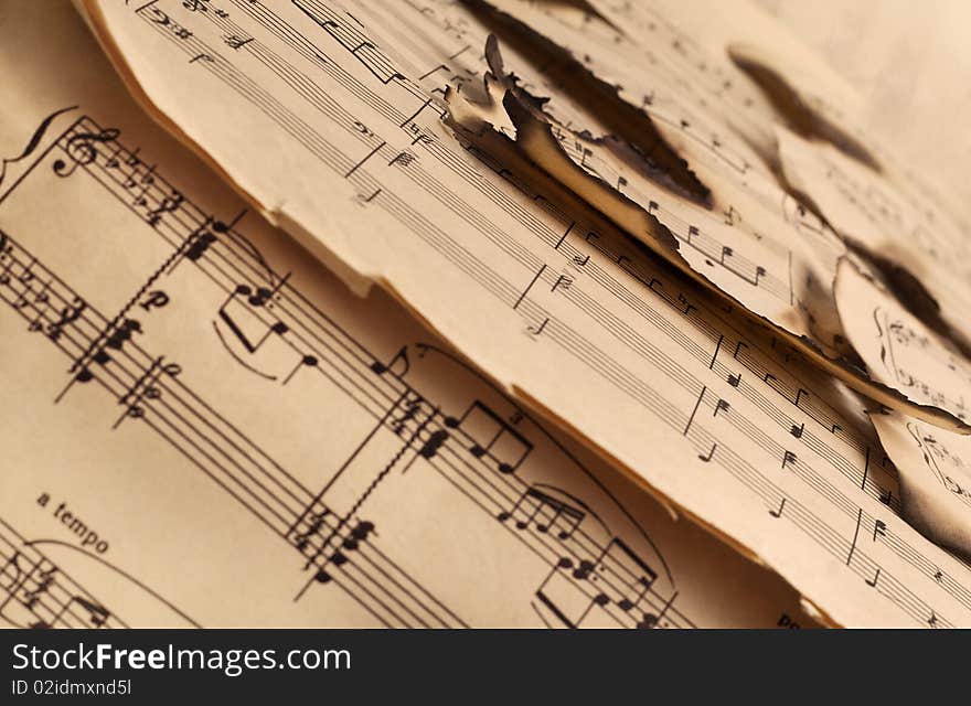 Vintage burnt music notes pattern