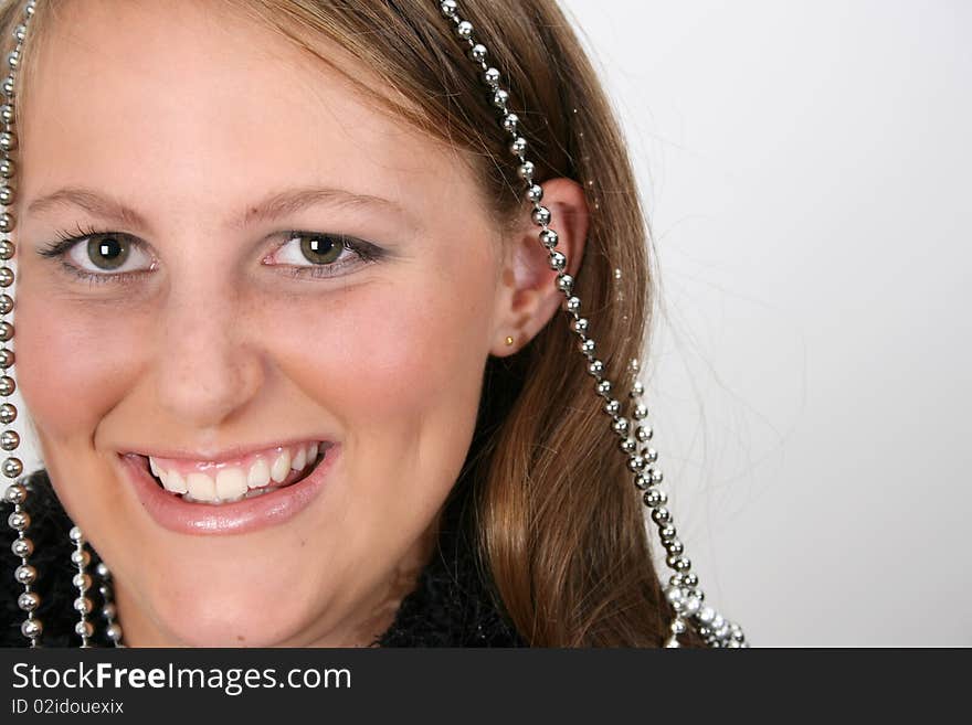 Close up of female teenager against a light background. Close up of female teenager against a light background