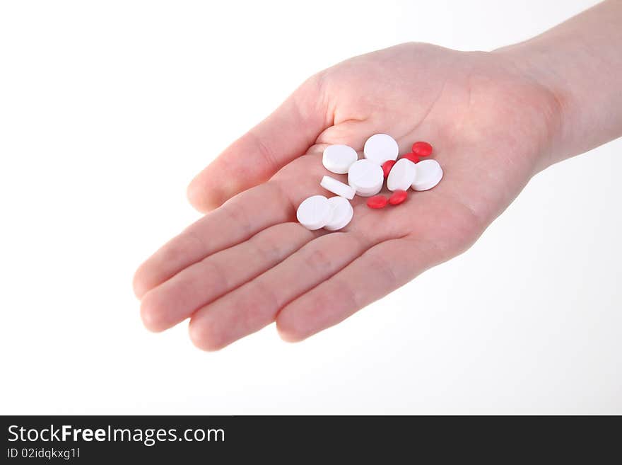 Holding red and white tablets. Holding red and white tablets