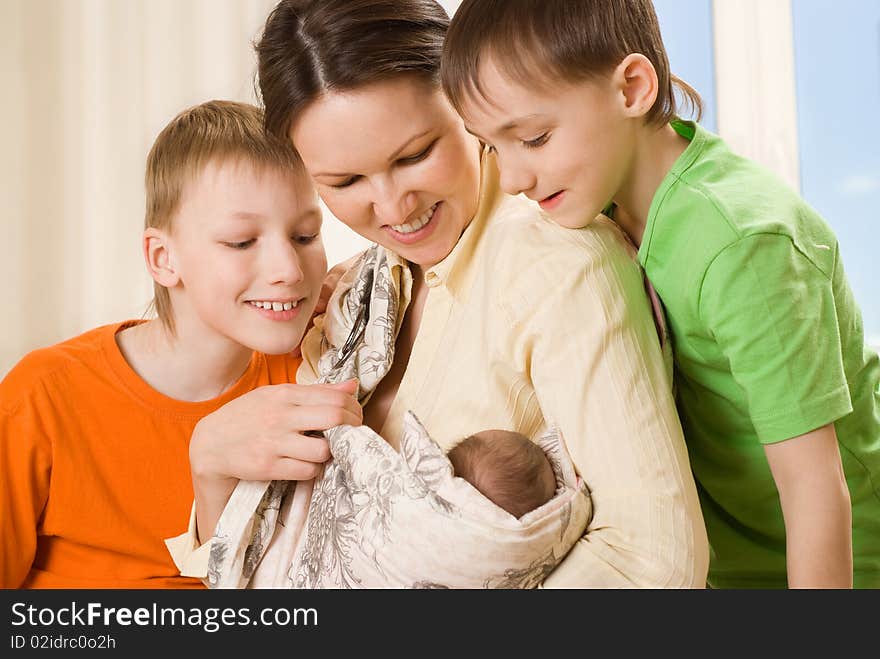 Happy mother with her three children together