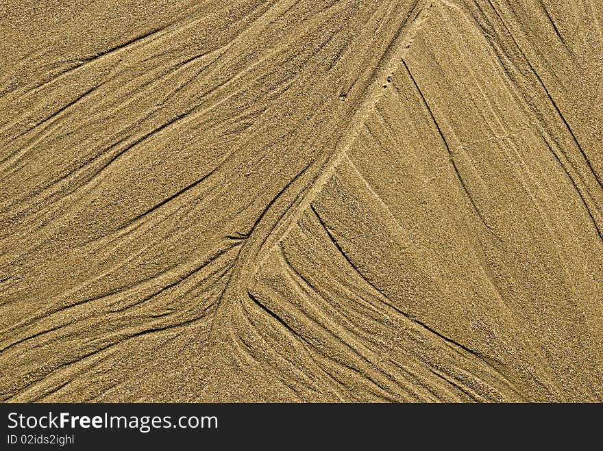 Pattern in the sand by the ocean