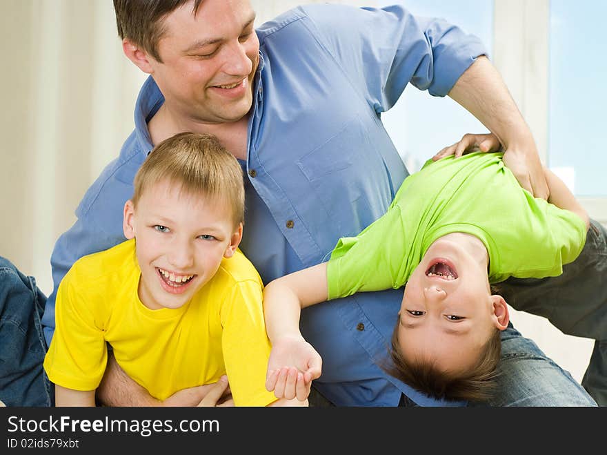 Brothers and father playing