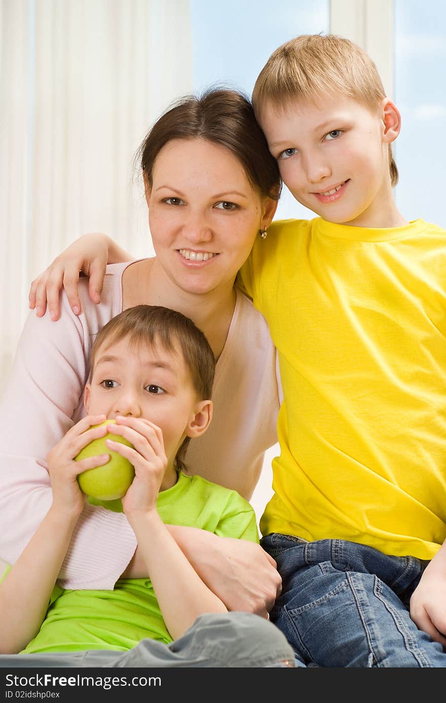 Mother next to her two children