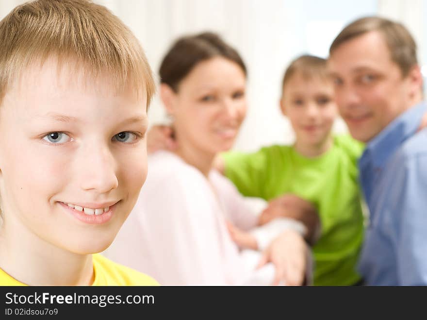 Boy Next To His Family