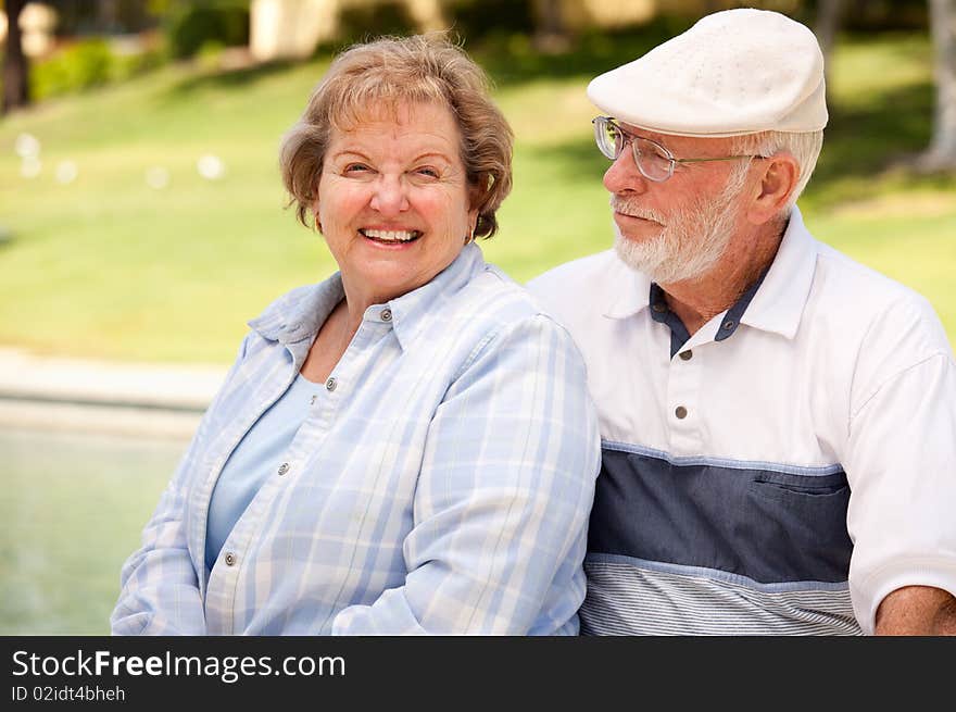 Happy Senior Couple Enjoying Each Other in The Park. Happy Senior Couple Enjoying Each Other in The Park.