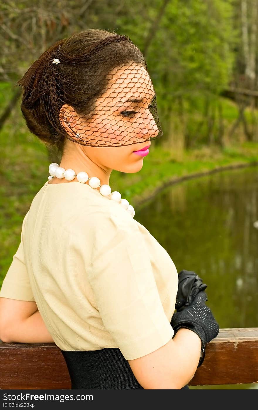 Retro style woman near the river