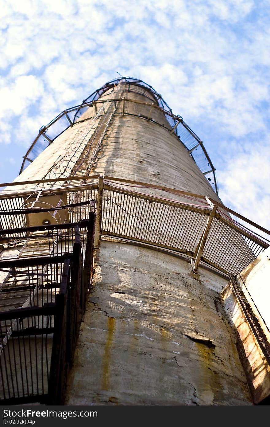 Industry chimney in a blue sky on sunny day